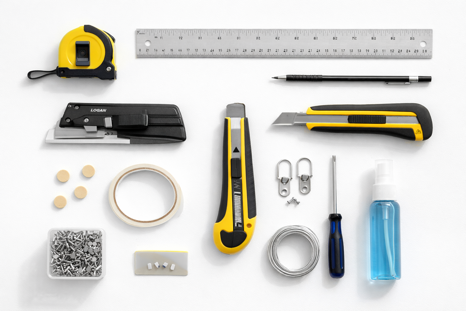 Essential DIY picture framing tools including mat cutter, ruler, point driver, glazier points, and hanging hardware